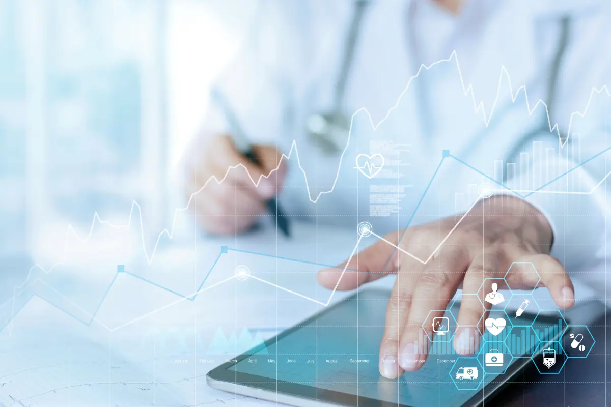 Analyst reviewing healthcare research data and dashboards