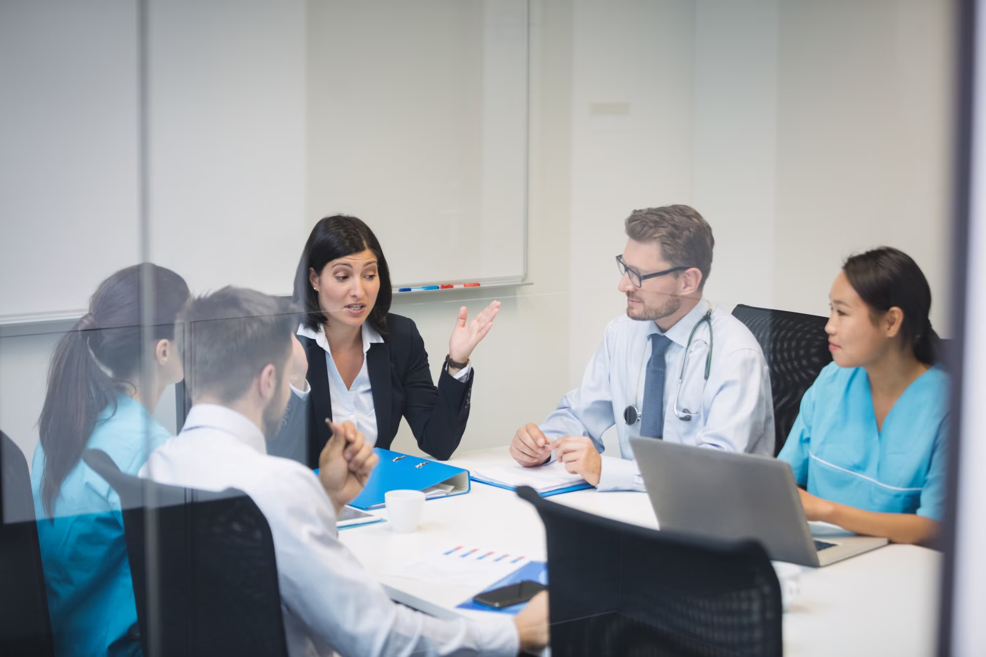 Healthcare business leaders reviewing a growth plan in a meeting