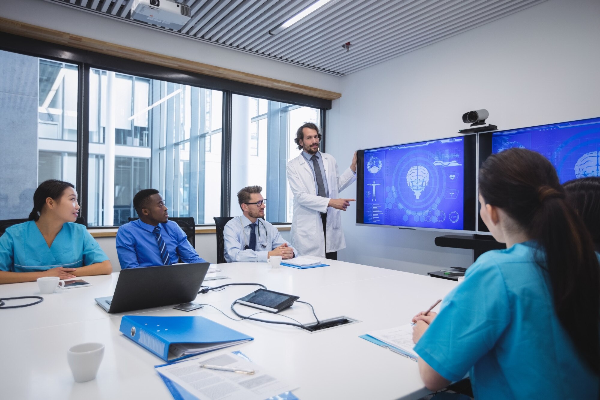 EUMEDIC healthcare team collaborating in a modern office