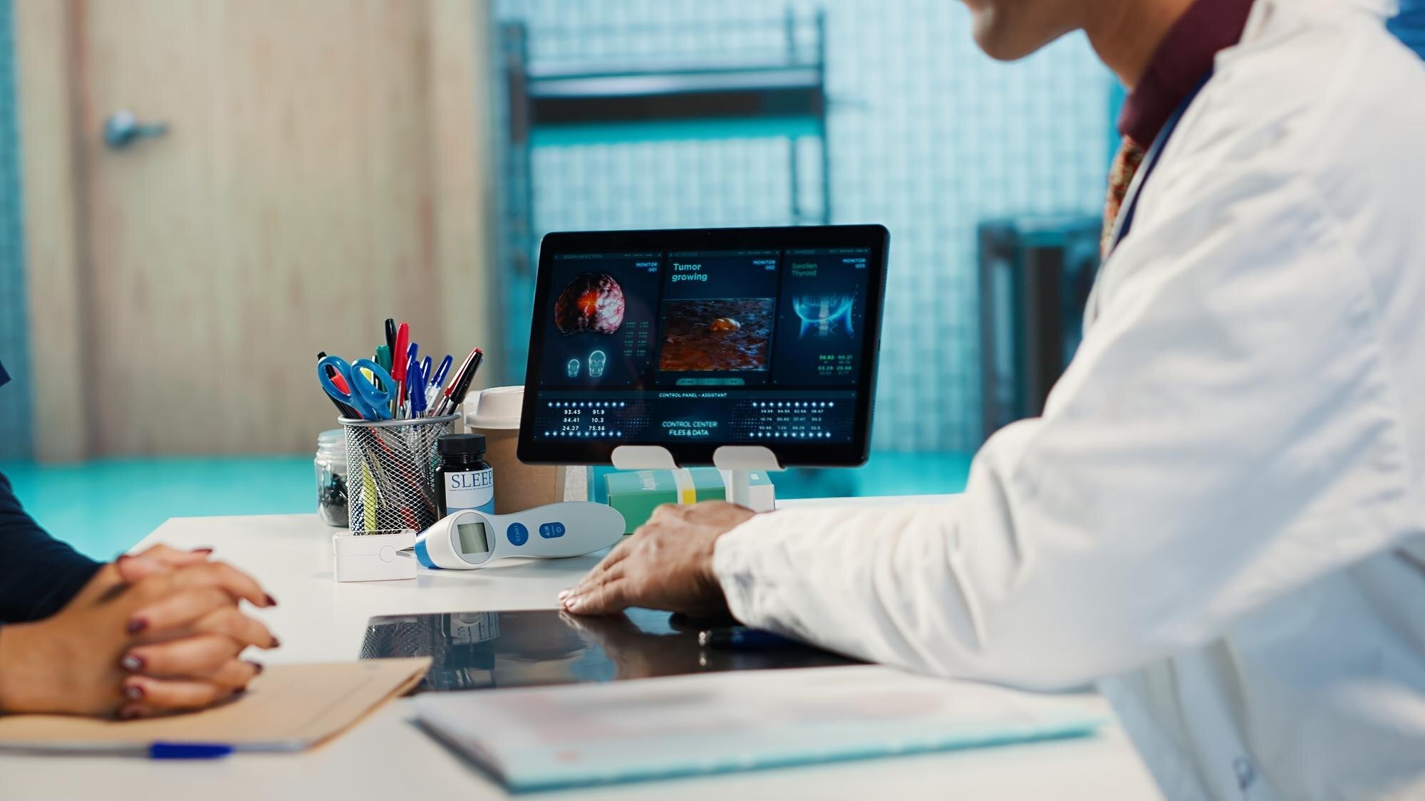 Analyst reviewing a healthcare data dashboard on screen